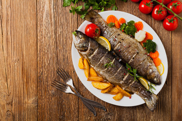 Grilled whole trout. Served with baked potatoes.