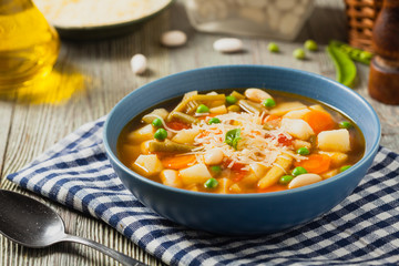 Minestrone soup with pasta and cheese.