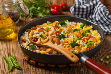 Nasi goreng. Fried rice with egg and vegetables.