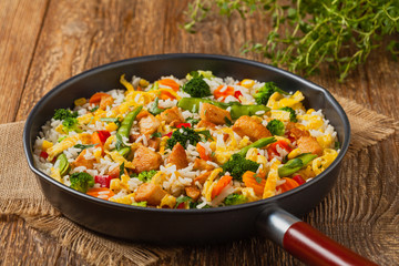 Nasi goreng. Fried rice with egg and vegetables.