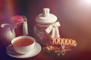 Set for breakfast. Sweets and pastries with nuts for tea on a black background.