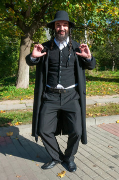 Portrait of happy smiling dancing orthodox Jewish man