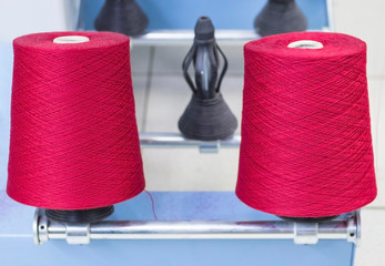 two spools of yarn on the winding machine