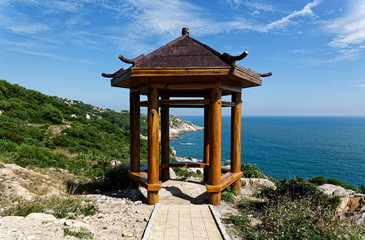 Pagoda pavilion, seashore and blue sky