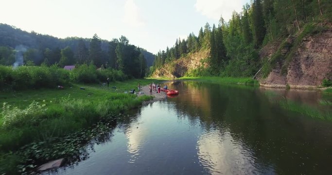 Epic Rafting Two Orange Boat on Shallow Mountain Forest Zilim River in Ural Mountains, Russia at summer sunny day - Aerial view