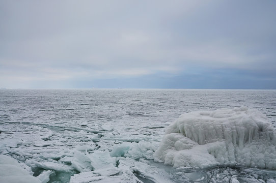 Fototapeta Frozen ice-covered sea and blocks of ice. Winter sea. Black Sea.  