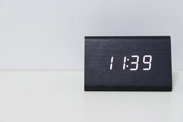 Black digital clock on a white background showing time 11:39