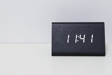 Black digital clock on a white background showing time 11:41