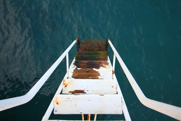 stairs to the sea from the pier
