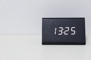 Black digital clock on a white background showing time 13:25