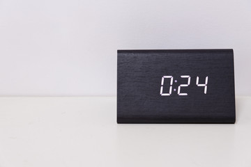 Black digital clock on a white background showing time 0:24