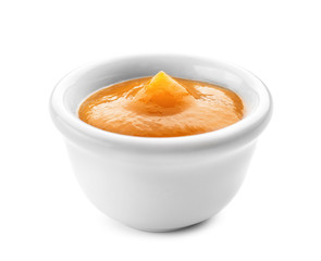 Tasty sauce in bowl on white background