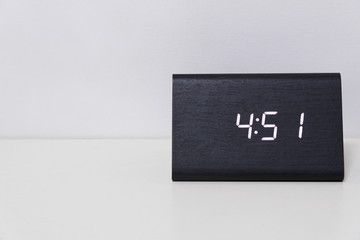 Black digital clock on a white background showing time 4:51