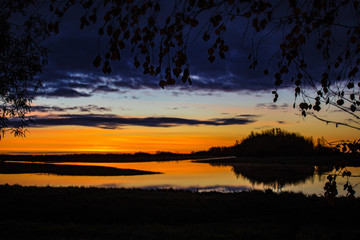beautiful sunrise on a wild lake in autumn