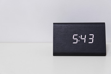 Black digital clock on a white background showing time 5:43