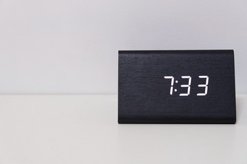 Black digital clock on a white background showing time 7:33