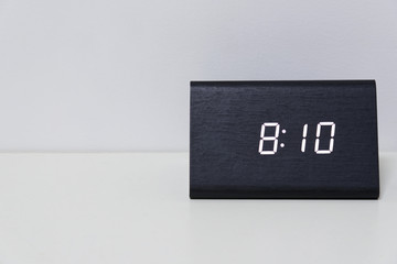 Black digital clock on a white background showing time 8:10