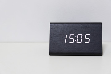 Black digital clock on a white background showing time 15:05