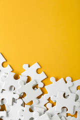Pieces of jigsaw puzzle on color background