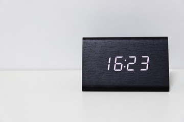Black digital clock on a white background showing time 16:23