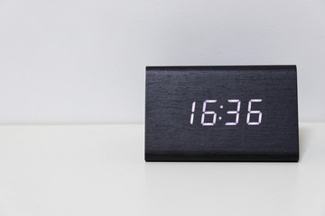 Black digital clock on a white background showing time 16:36