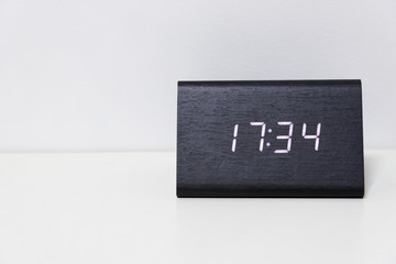 Black digital clock on a white background showing time 17:34