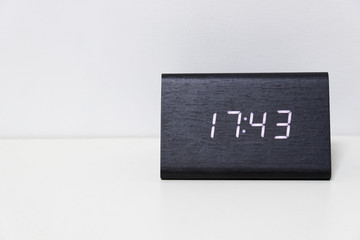 Black digital clock on a white background showing time 17:43