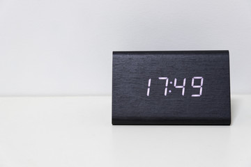 Black digital clock on a white background showing time 17:49