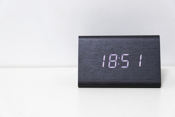 Black digital clock on a white background showing time 18:51