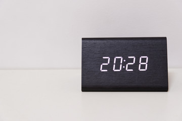 digital table clock showing 20:28 time