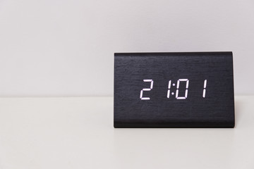 digital table clock showing 21:01 time
