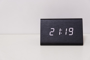 digital table clock showing 21:19 time