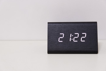 digital table clock showing 21:22 time