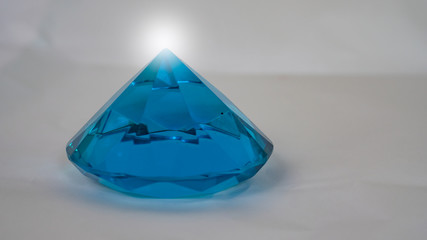 Blue diamonds on a white background and white light.