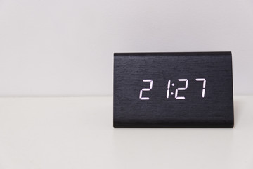 digital table clock showing 21:27 time