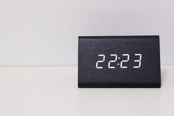 digital table clock showing 22:23 time