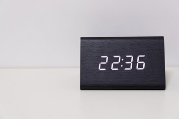 digital table clock showing 22:36 time