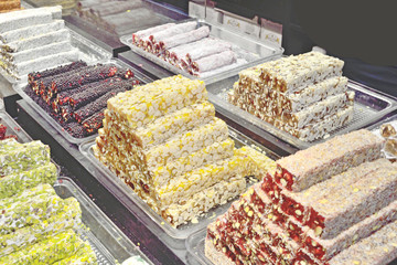 Turkish dessert of a different type - Turkish delight is on the counter in the cooking store