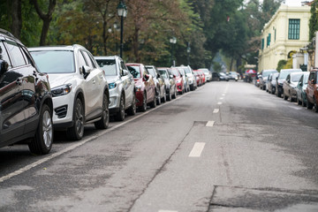 Cars parked on the urban street side