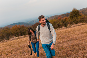 Young couple enjoying hiking in nature.