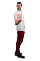 Handsome man with glasses eating popcorns