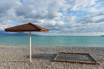 beach with umbrella and chair