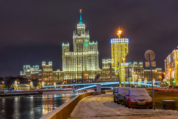 Fototapeta premium Kotelnicheskaya Embankment Building and Moscow river in Moscow, Russia. Architecture and landmarks of Moscow. Moscow with Christmas decoration.