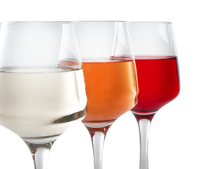 Glasses of tasty wine on white background, closeup