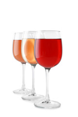 Glasses of different wine on white background