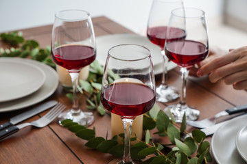 Glasses of wine on table set in restaurant