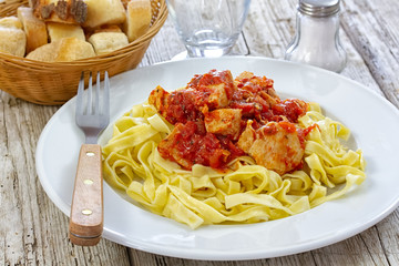 chicken, pasta with tomato sauce