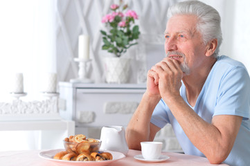 Portrait of a senior man having breakfast
