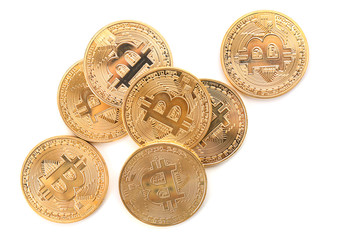 Golden bitcoins on white background