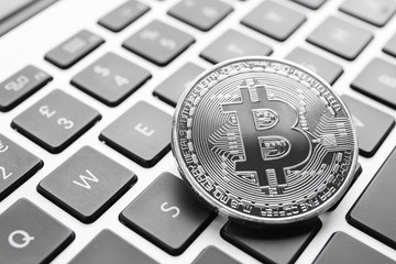 Silver bitcoin on PC keyboard